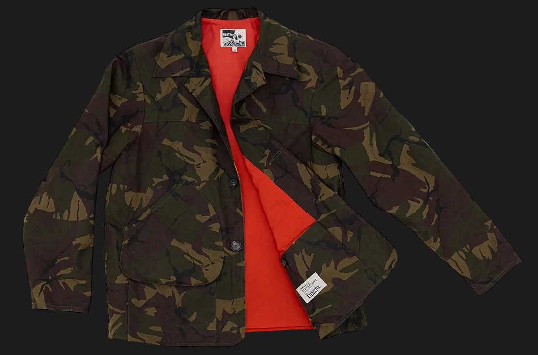 A Jacksnipe crosshair camouflage jacket with a bright red interior lining, shown open against a plain white background.