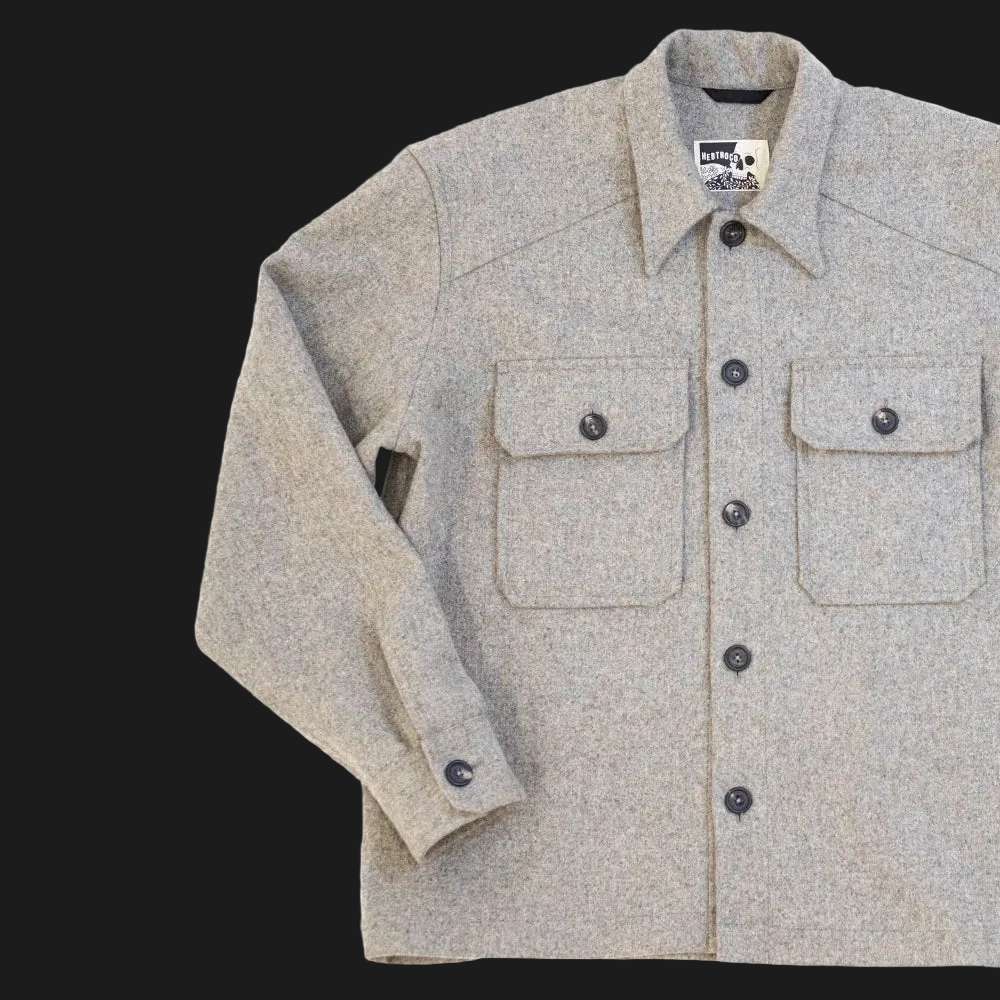 A USB37 wool overshirt with a button-down front, two chest flap pockets, and a pointed collar, shown on a plain white background.