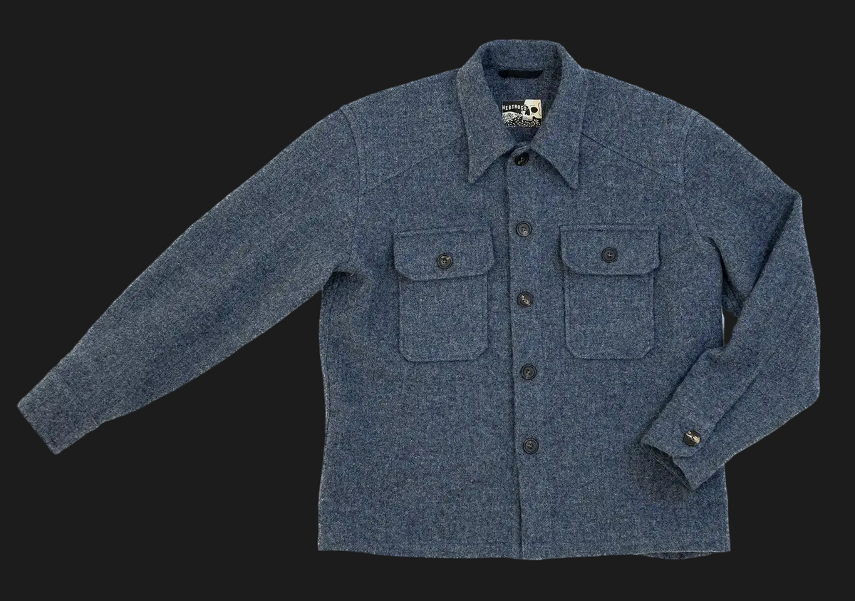 USB36 wool overshirt jacket with a button-down front, two buttoned chest pockets, and a classic collar, shown flat on a white background.